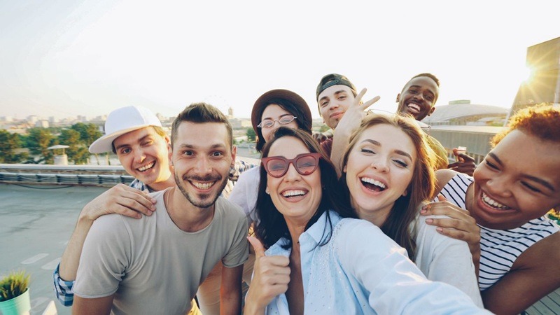 people taking a selfie while they play our scavenger hunt game